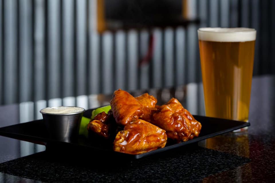 Tonight, all wing variations are half off *when you make a beer purchase