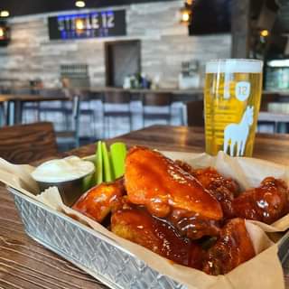 Wing Thursday! 💥 Half off any flavor of wings with the purchase of a beer or 4-p